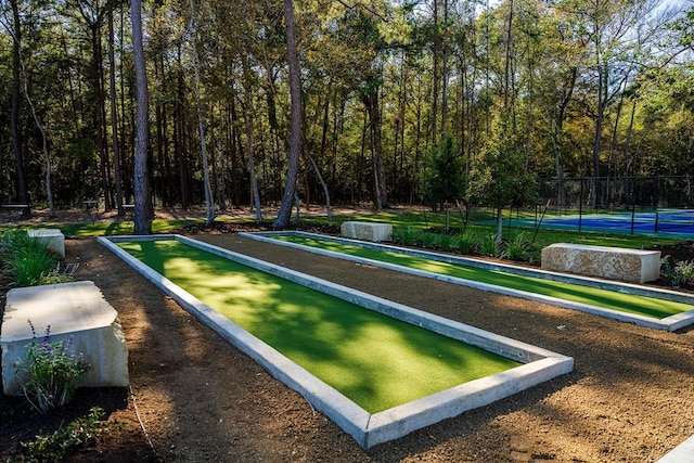 21877 Colorado Bend Ln, Porter, TX 77365 - surrounding community featuring a bocce ball area and a view of trees