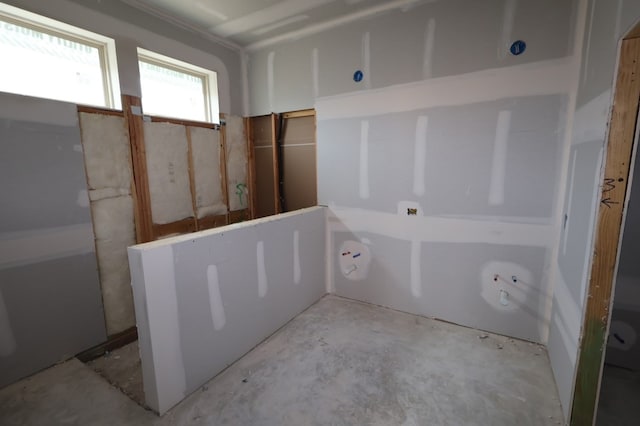 21877 Colorado Bend Ln, Porter, TX 77365 - bathroom with unfinished concrete floors and a tub