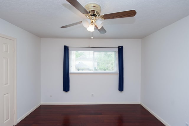 empty room featuring baseboards, a textured ceiling, wood finished floors, and a ceiling fan