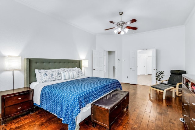 bedroom featuring a ceiling fan, crown molding, and wood-type flooring