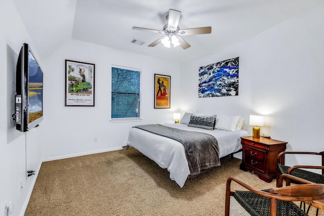 carpeted bedroom with baseboards, visible vents, and a ceiling fan