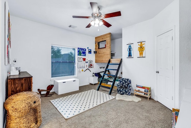 bedroom with carpet floors, visible vents, and a ceiling fan