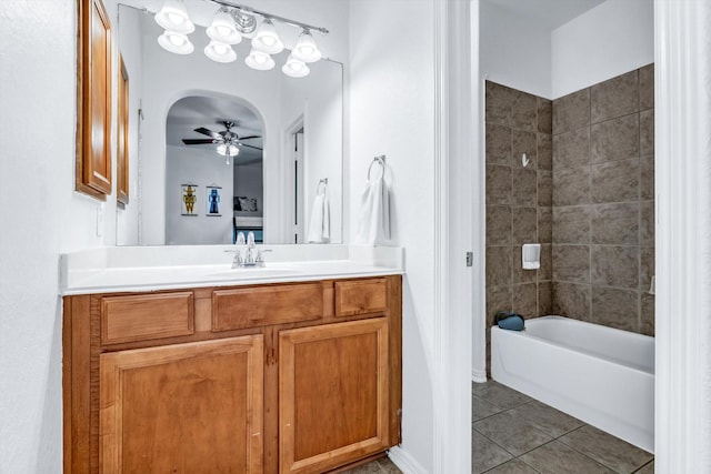 bathroom featuring shower / tub combination, tile patterned flooring, vanity, and a ceiling fan