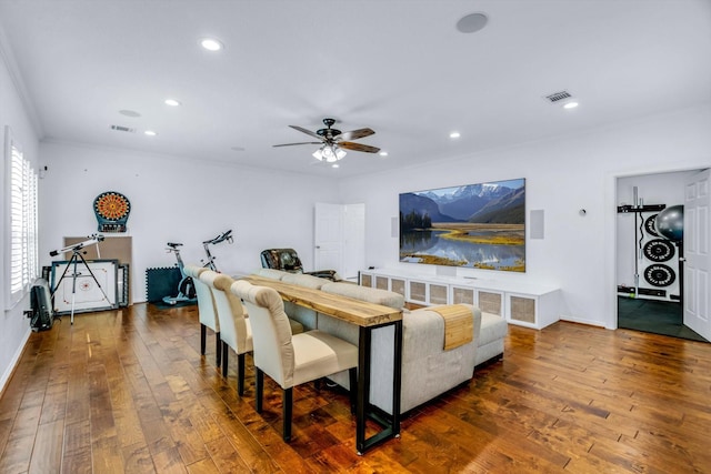 living area with ceiling fan, visible vents, recessed lighting, and wood-type flooring