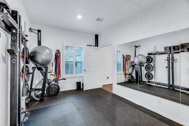 workout area with recessed lighting, baseboards, attic access, and visible vents