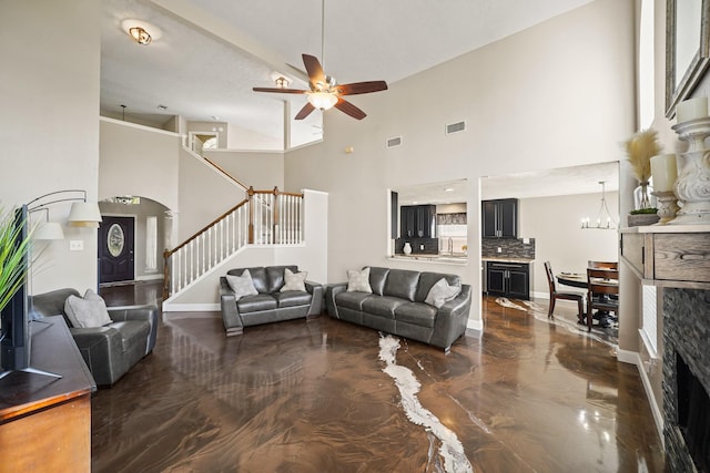 10515 Wind Walker Trl, Houston, TX 77095 - living area with stairway, a high ceiling, ceiling fan with notable chandelier, and visible vents