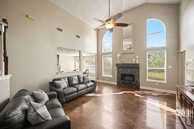 10515 Wind Walker Trl, Houston, TX 77095 - living area featuring a ceiling fan, baseboards, visible vents, high vaulted ceiling, and a fireplace