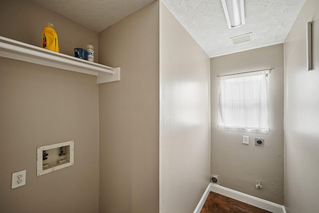 10515 Wind Walker Trl, Houston, TX 77095 - laundry area featuring wood finished floors, laundry area, electric dryer hookup, baseboards, and hookup for a washing machine