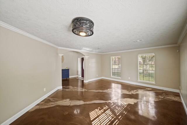 10515 Wind Walker Trl, Houston, TX 77095 - spare room featuring arched walkways, a textured ceiling, crown molding, and ornate columns