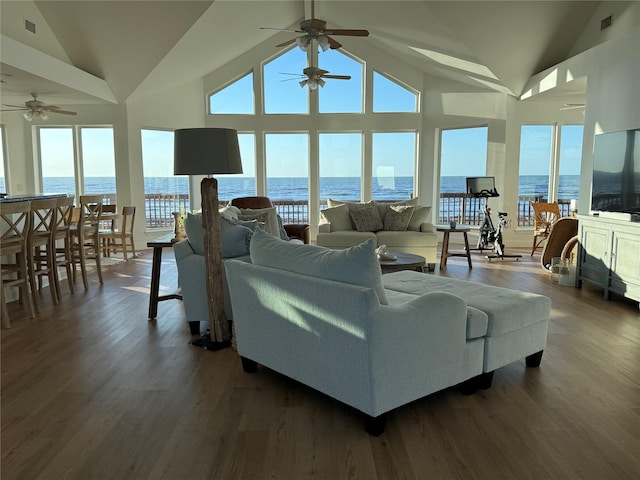 living room featuring a ceiling fan, dark wood-style flooring, high vaulted ceiling, and visible vents