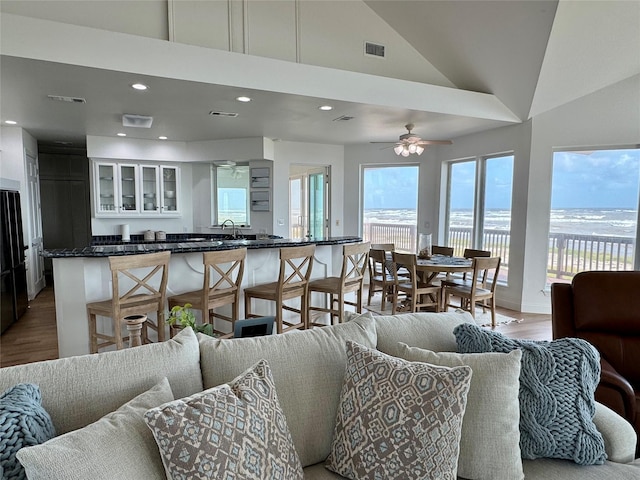 living area featuring recessed lighting, light wood-style flooring, visible vents, and ceiling fan