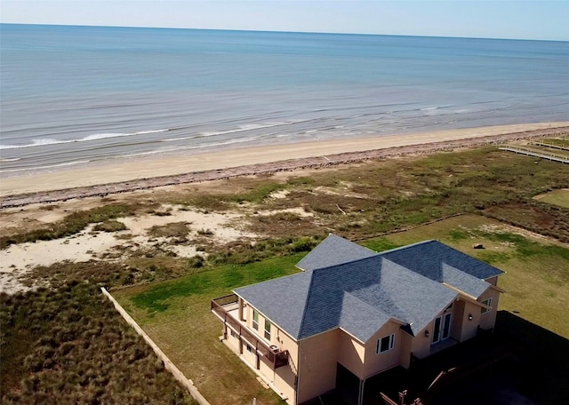 aerial view featuring a water view and a view of the beach