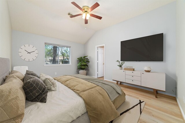 7014 Woodland Oaks, Magnolia, TX 77354 - bedroom with light wood-type flooring, vaulted ceiling, baseboards, and a ceiling fan