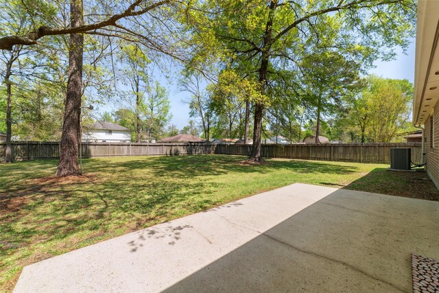 7014 Woodland Oaks, Magnolia, TX 77354 - view of yard featuring a patio area and cooling unit