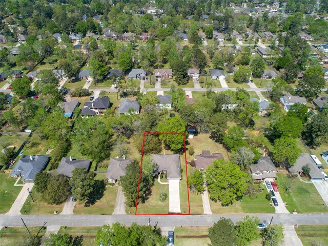 7014 Woodland Oaks, Magnolia, TX 77354 - aerial perspective of suburban area with property boundaries highlighted