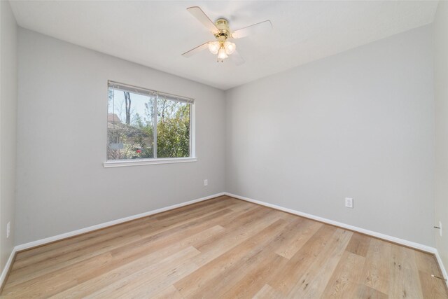 7014 Woodland Oaks, Magnolia, TX 77354 - spare room with a ceiling fan, baseboards, and wood finished floors