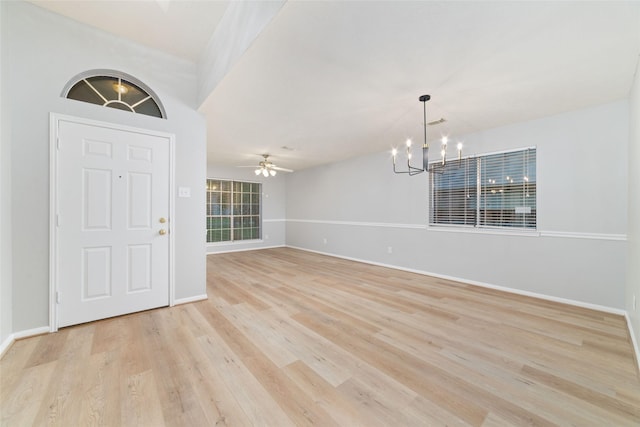 7014 Woodland Oaks, Magnolia, TX 77354 - entryway featuring a chandelier, light wood finished floors, baseboards, and ceiling fan