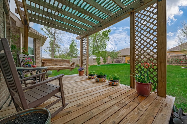 wooden terrace with a pergola, a fenced backyard, and a lawn