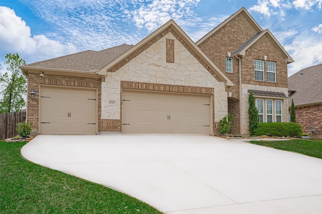 view of front of property featuring a garage, roof with shingles, fence, brick siding, and concrete driveway