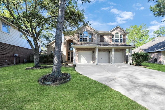traditional-style home featuring driveway, a garage, stone siding, and a front yard