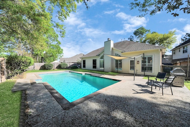 view of swimming pool with a fenced backyard, a fenced in pool, and a patio area