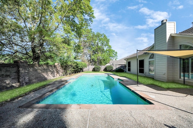 view of swimming pool featuring a patio, a fenced in pool, and a fenced backyard