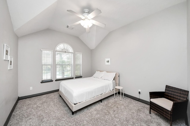 bedroom featuring a ceiling fan, carpet floors, baseboards, and vaulted ceiling