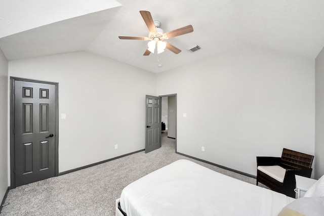 bedroom featuring vaulted ceiling, light carpet, baseboards, visible vents, and ceiling fan