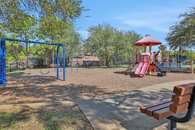 community jungle gym featuring fence