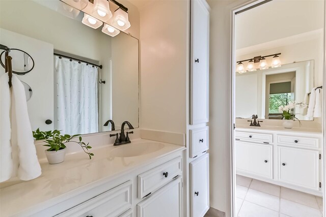 307 Crestwood Dr, El Lago, TX 77586 - full bathroom featuring a sink, tile patterned flooring, and two vanities
