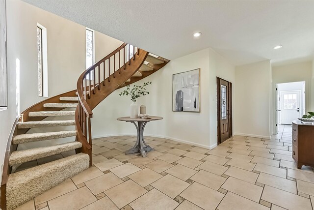 307 Crestwood Dr, El Lago, TX 77586 - stairs featuring tile patterned flooring, baseboards, and recessed lighting