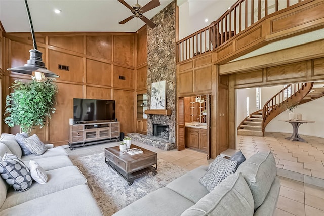 307 Crestwood Dr, El Lago, TX 77586 - living room featuring wooden walls, built in features, light tile patterned floors, visible vents, and ceiling fan