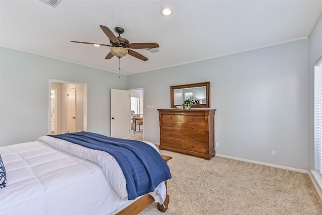 307 Crestwood Dr, El Lago, TX 77586 - bedroom featuring a textured ceiling, baseboards, ceiling fan, connected bathroom, and light colored carpet