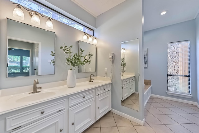 307 Crestwood Dr, El Lago, TX 77586 - bathroom with double vanity, a bath, tile patterned flooring, and a sink