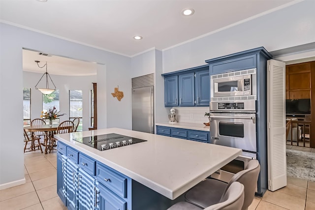 307 Crestwood Dr, El Lago, TX 77586 - kitchen featuring light countertops, blue cabinets, crown molding, and built in appliances