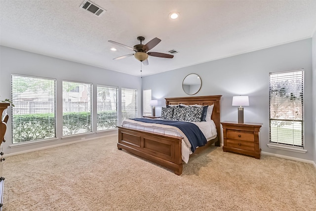 307 Crestwood Dr, El Lago, TX 77586 - bedroom featuring light colored carpet, visible vents, and a textured ceiling