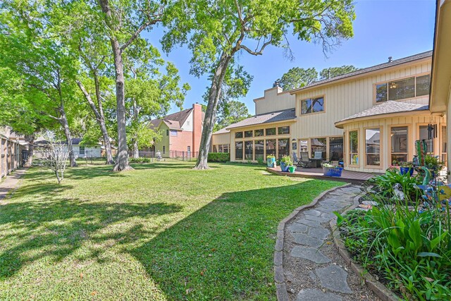 307 Crestwood Dr, El Lago, TX 77586 - view of yard featuring fence and a wooden deck