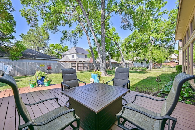 307 Crestwood Dr, El Lago, TX 77586 - deck with a fenced backyard, a lawn, and outdoor dining space