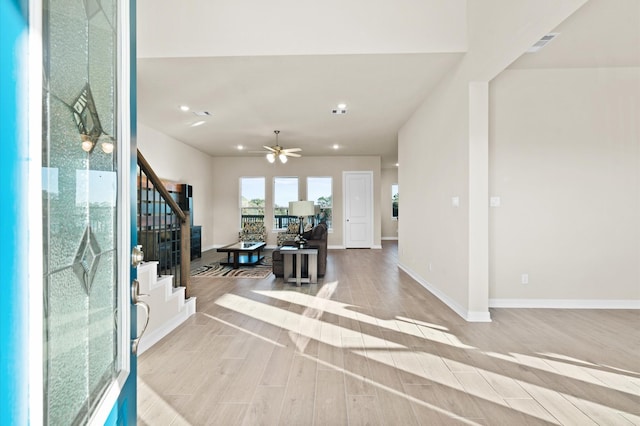 1922 Peacock Isle Dr, Dickinson, TX 77539 - entryway featuring stairs, light wood-style flooring, recessed lighting, baseboards, and ceiling fan