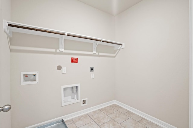 1922 Peacock Isle Dr, Dickinson, TX 77539 - laundry room with electric dryer hookup, hookup for a washing machine, baseboards, gas dryer hookup, and light tile patterned floors