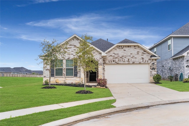 view of front of home with driveway, a front yard, stone siding, an attached garage, and a shingled roof