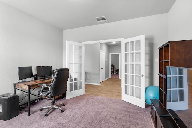 office with visible vents, carpet floors, and french doors