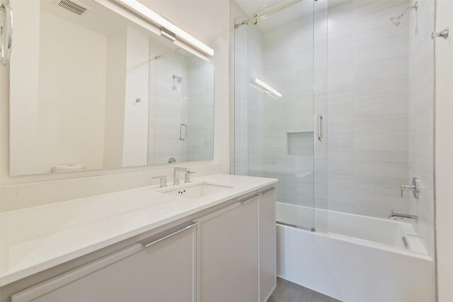 12838 Verdi Dr, Houston, TX 77024 - full bath featuring combined bath / shower with glass door, vanity, and visible vents