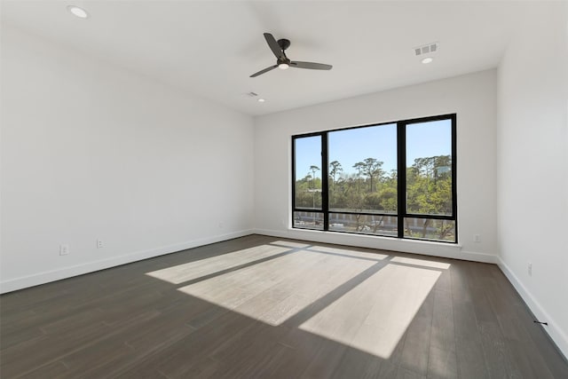 12838 Verdi Dr, Houston, TX 77024 - empty room with baseboards, dark wood-style flooring, visible vents, and a ceiling fan
