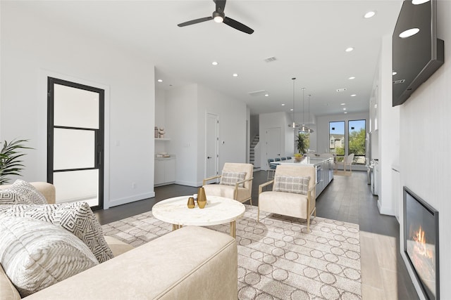 12838 Verdi Dr, Houston, TX 77024 - living area featuring visible vents, stairs, wood finished floors, recessed lighting, and a ceiling fan