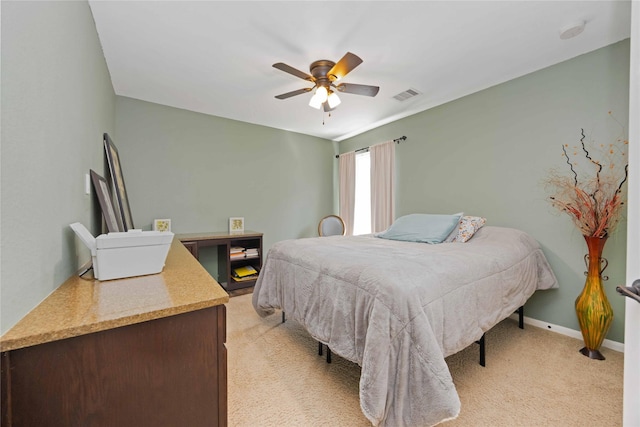 6226 Oxford Lake Dr, Rosenberg, TX 77471 - bedroom featuring light colored carpet, visible vents, baseboards, and a ceiling fan