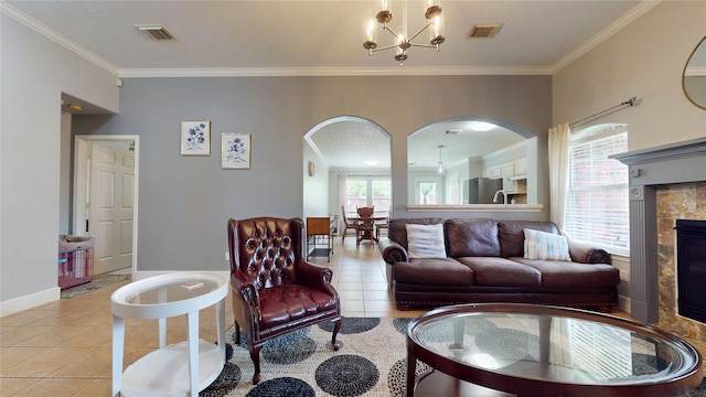 tiled living area with arched walkways, crown molding, and visible vents