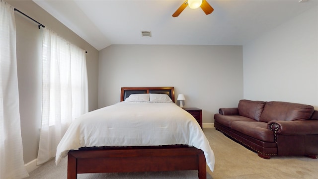 bedroom featuring visible vents, baseboards, ceiling fan, light carpet, and lofted ceiling
