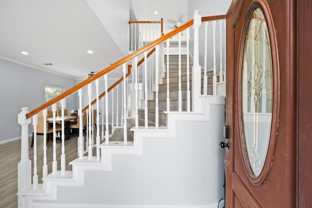 13619 Bonilla Ln, Houston, TX 77083 - entryway with crown molding, baseboards, stairs, and recessed lighting