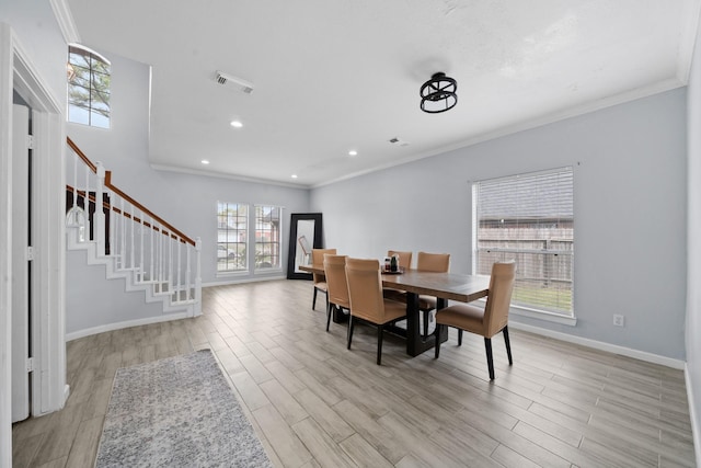 13619 Bonilla Ln, Houston, TX 77083 - dining room featuring stairs, visible vents, light wood-style floors, and ornamental molding